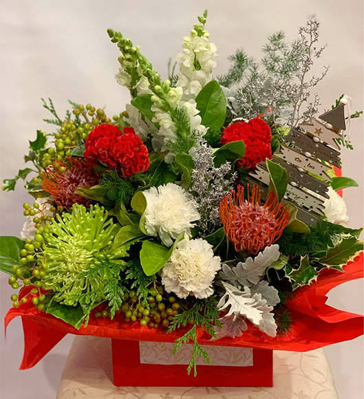 Image of floral arrangement - Christmas theme flowers